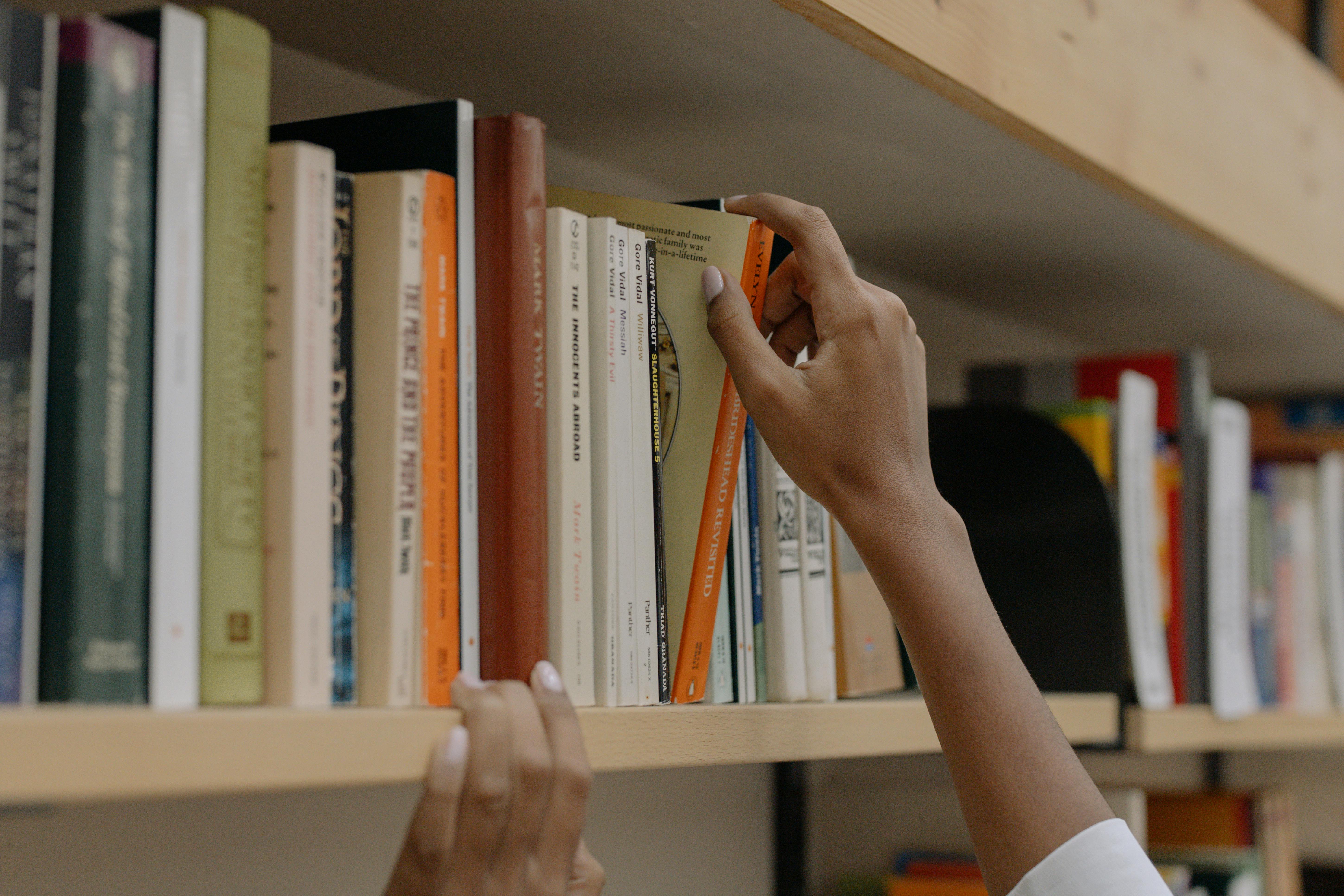 taking a book from the shelf